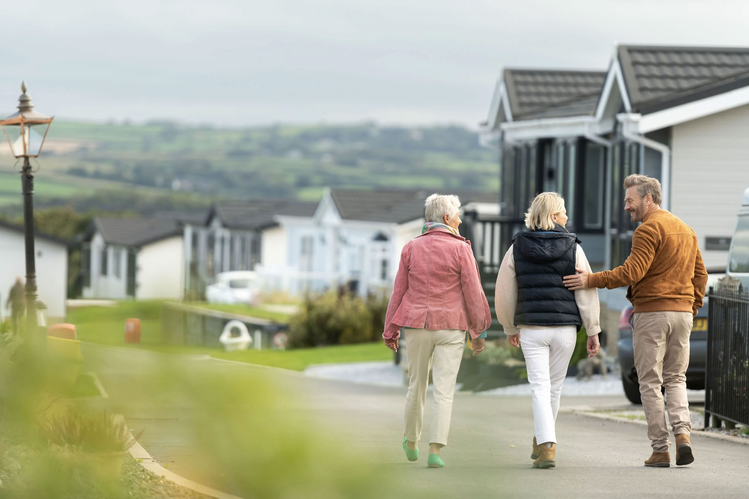 Couple meeting with their neighbour at Meadowlands Court, Cornwall